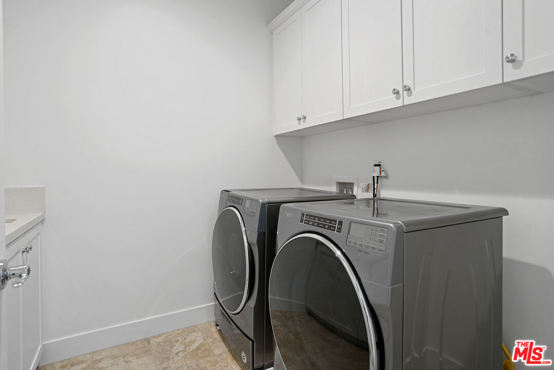 20618 West Wood Rose Court Porter Ranch, CA 91326 - Photo 41 of 44 a utility room with dryer and washer