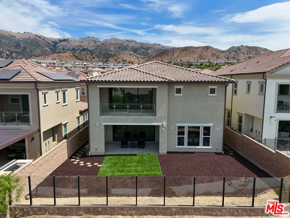 20618 West Wood Rose Court Porter Ranch, CA 91326 - Photo 42 of 44 a front view of a house with a yard