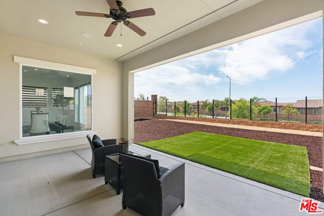 20618 West Wood Rose Court Porter Ranch, CA 91326 - Photo 43 of 44 a view of a patio with a dining table and chairs