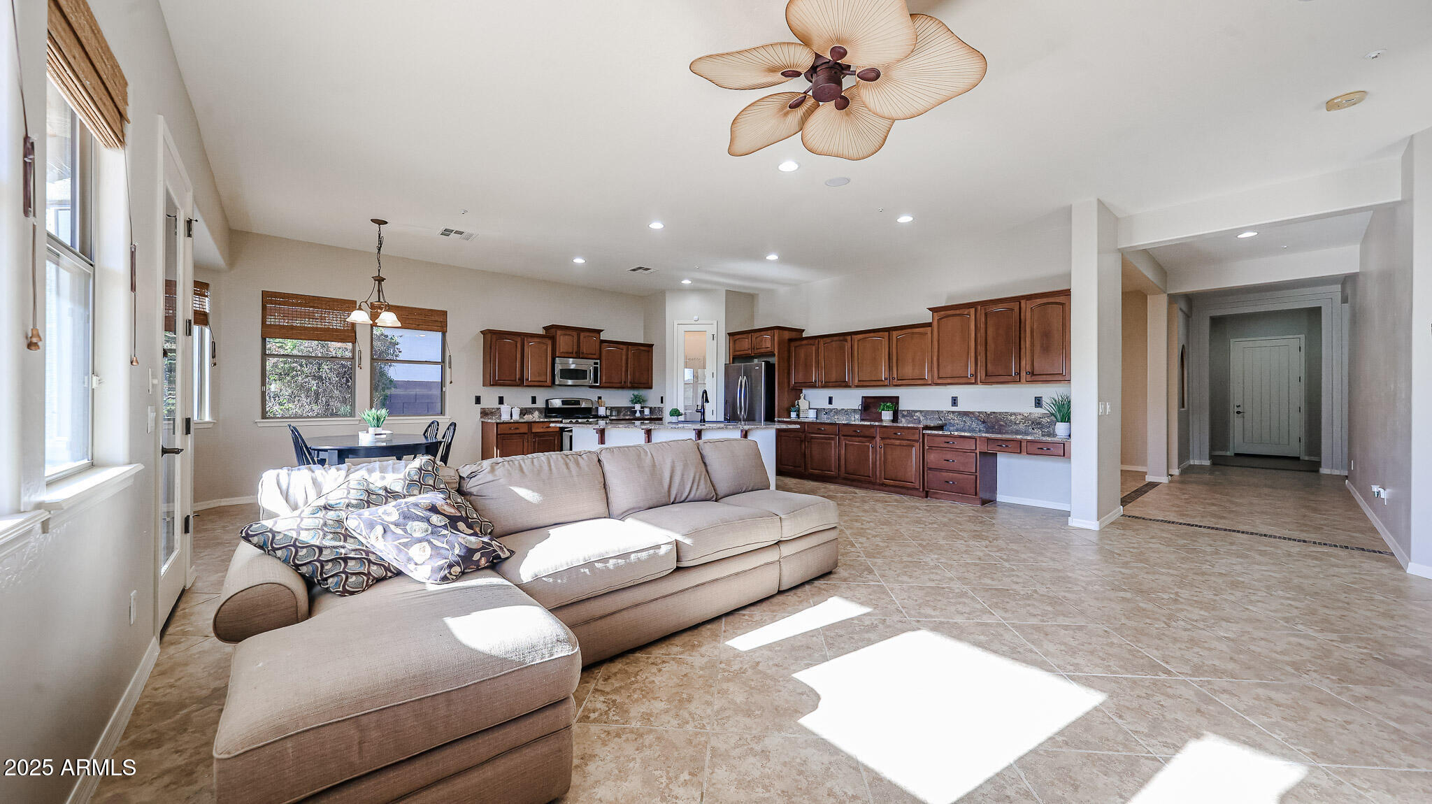 18391 Verdin Road Goodyear, AZ 85338 - Photo 29 of 94 a living room with furniture and kitchen view