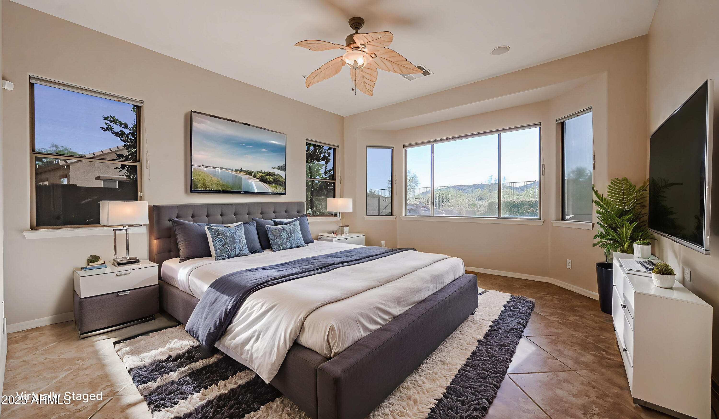 18391 Verdin Road Goodyear, AZ 85338 - Photo 30 of 94 a bedroom with bed and a flat tv screen on dresser