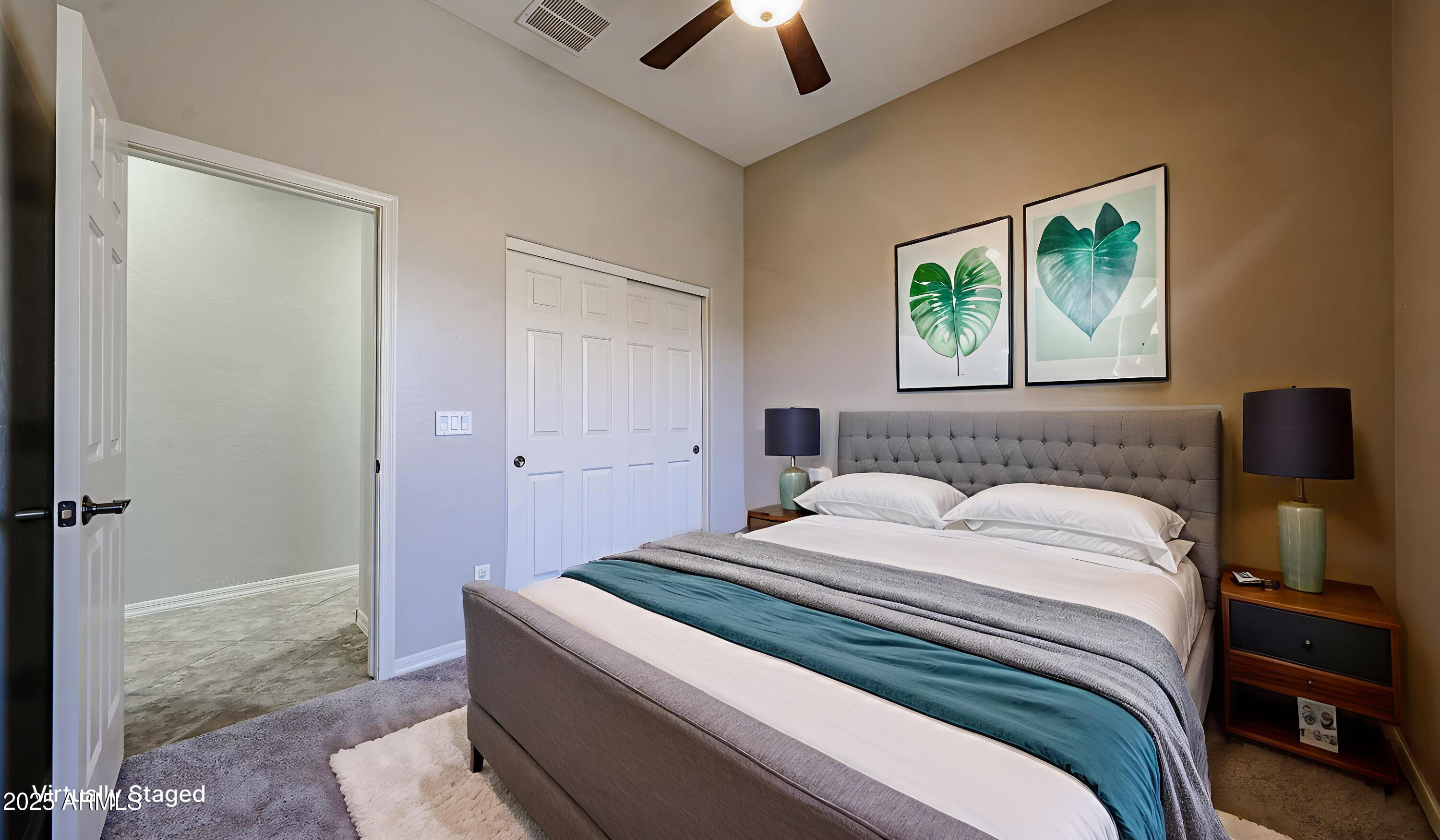 18391 Verdin Road Goodyear, AZ 85338 - Photo 39 of 94 a bedroom with a bed and a painting on the wall