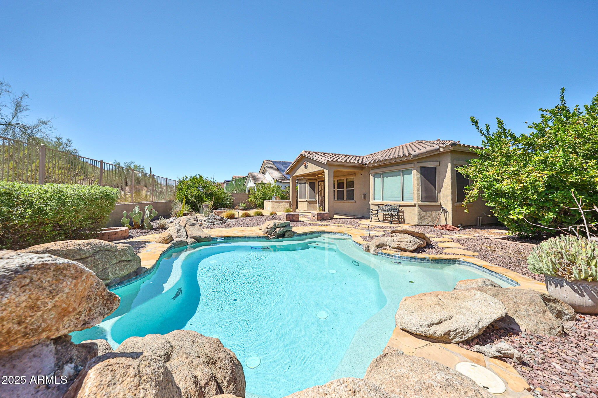 18391 Verdin Road Goodyear, AZ 85338 - Photo 50 of 94 Backyard with Sparkling Pool