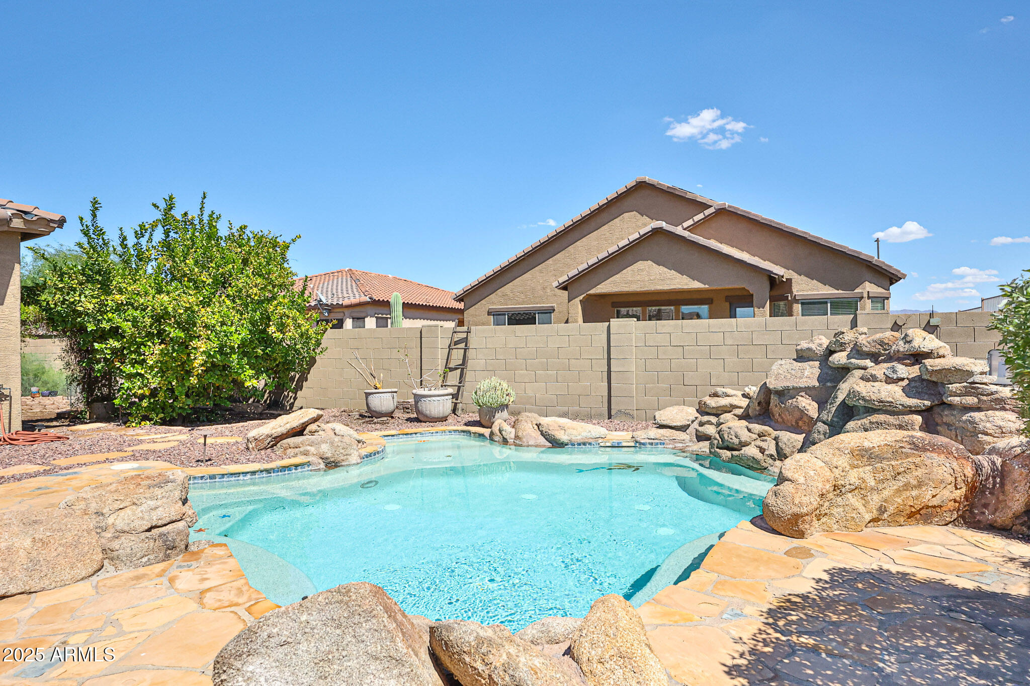 18391 Verdin Road Goodyear, AZ 85338 - Photo 52 of 94 a front view of a house with a yard and garage