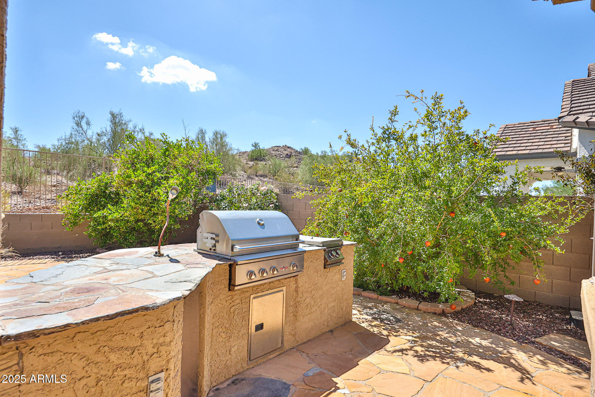 18391 Verdin Road Goodyear, AZ 85338 - Photo 56 of 94 a view of a backyard with sitting area