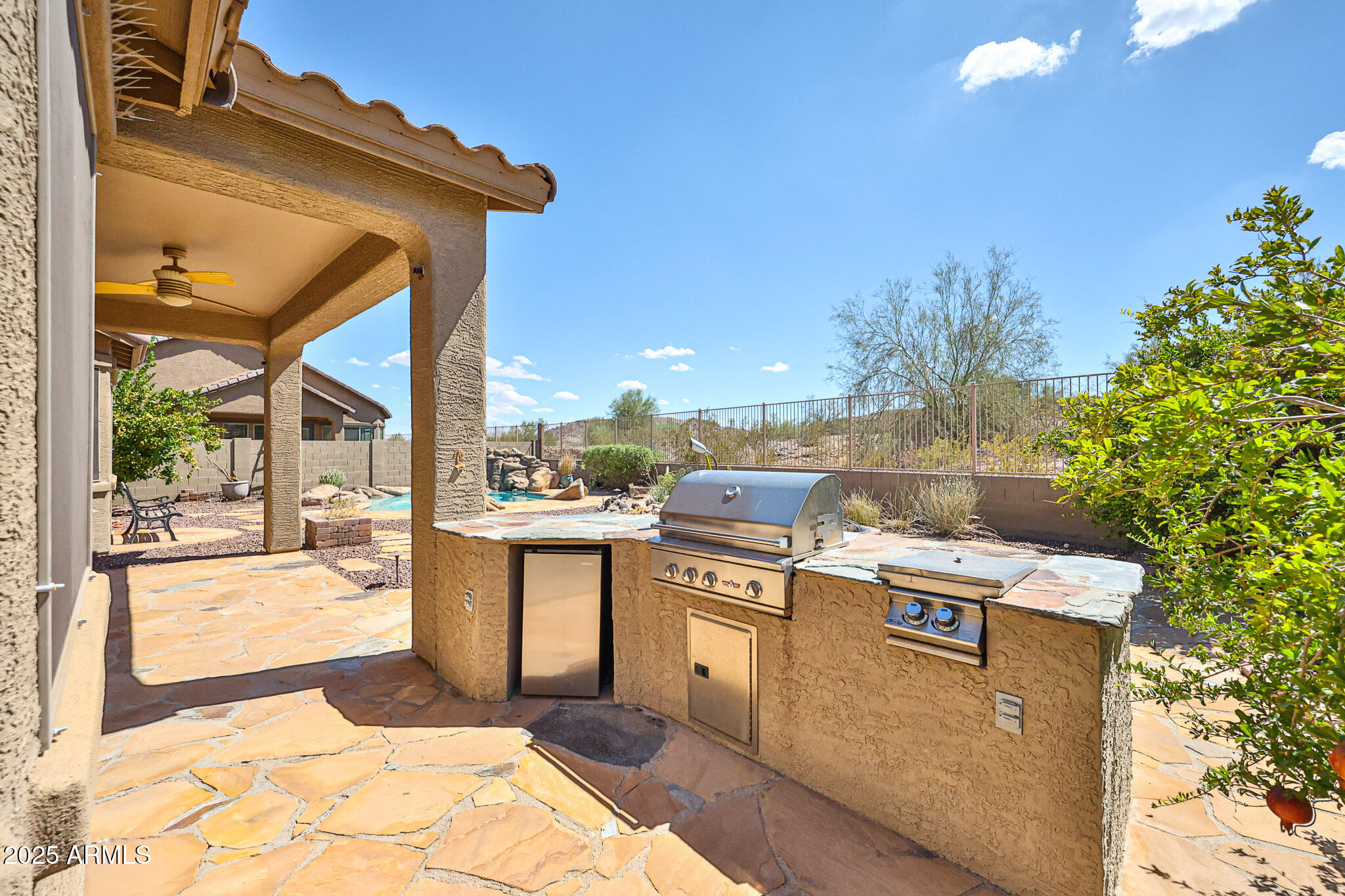 18391 Verdin Road Goodyear, AZ 85338 - Photo 57 of 94 a view of a kitchen with a stove