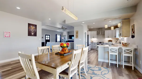 a view of a living room and kitchen with furniture