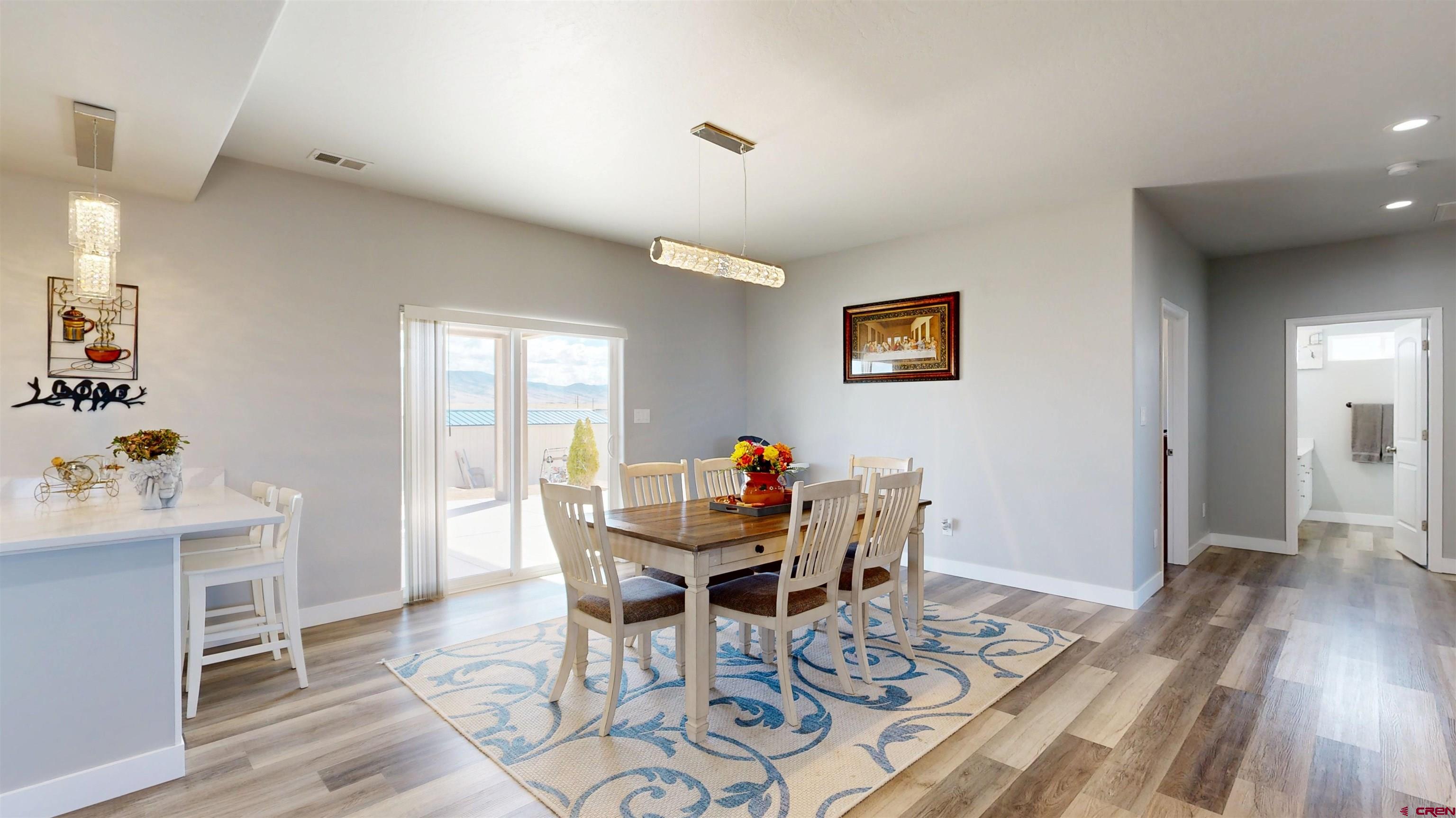 3728 Ruth Lane Delta, CO 81416 - Photo 14 of 34 a view of a dining room with furniture and wooden floor