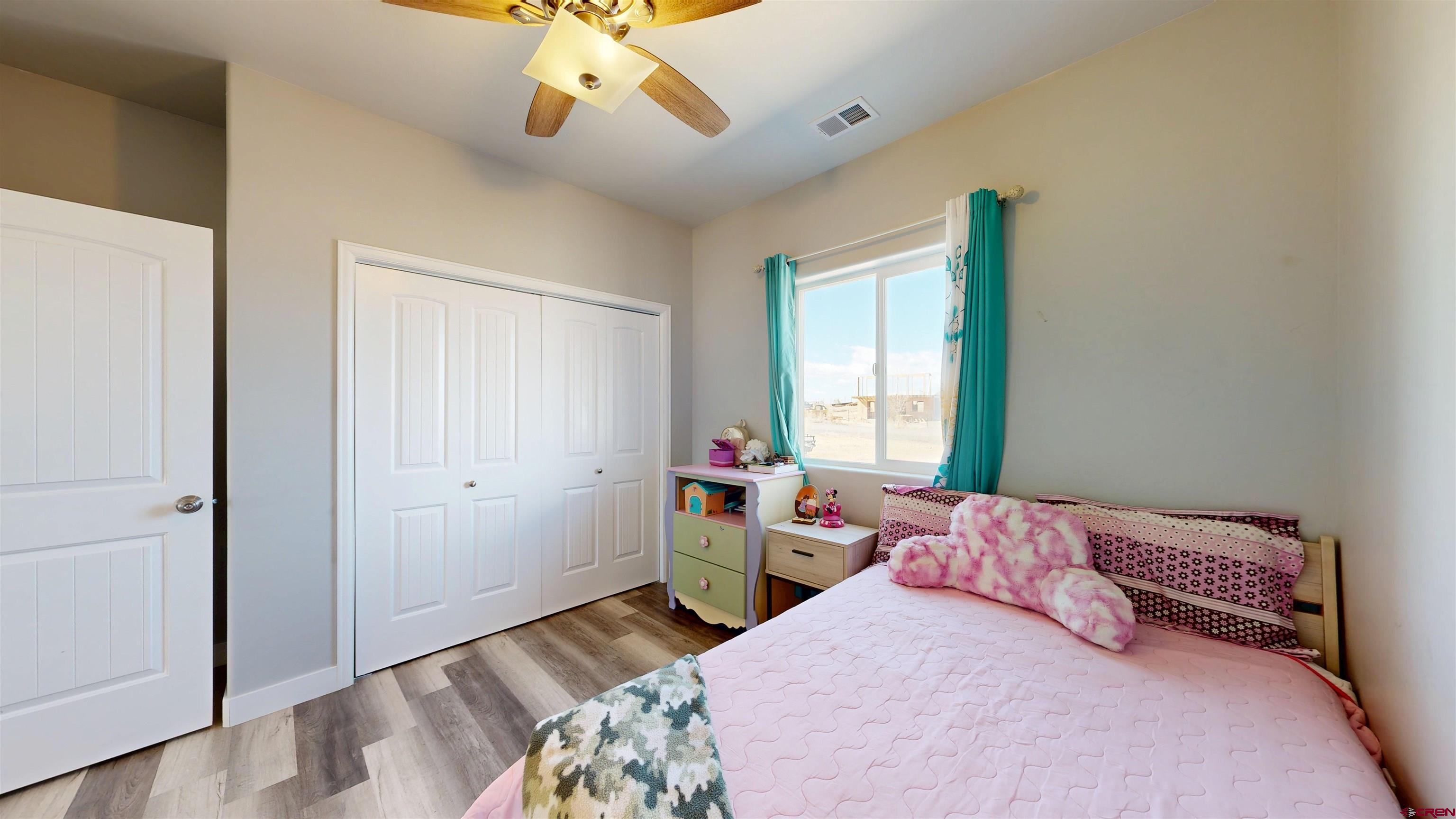 3728 Ruth Lane Delta, CO 81416 - Photo 17 of 34 a bedroom with a bed and a window