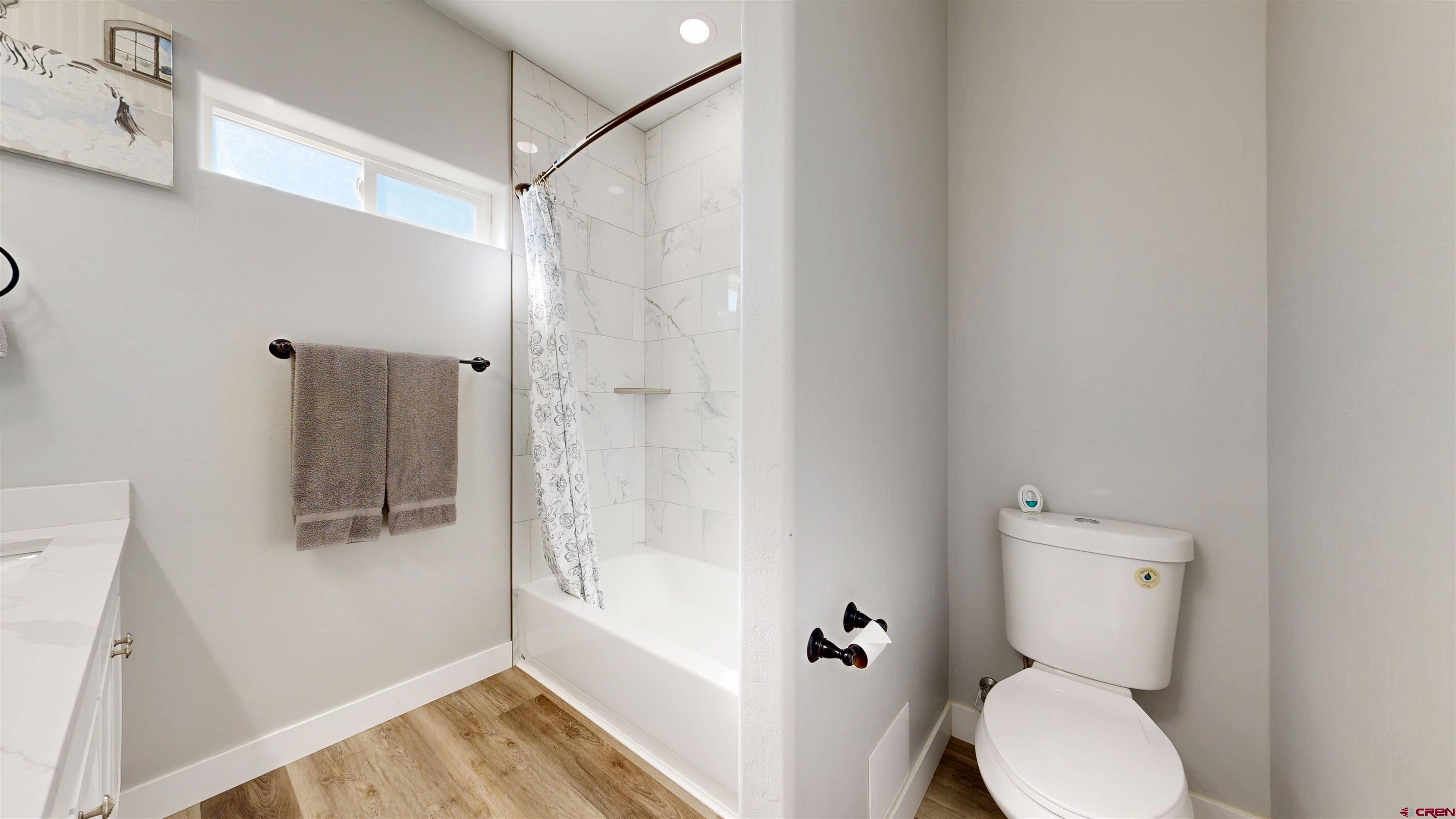 3728 Ruth Lane Delta, CO 81416 - Photo 20 of 34 a bathroom with a toilet and a shower