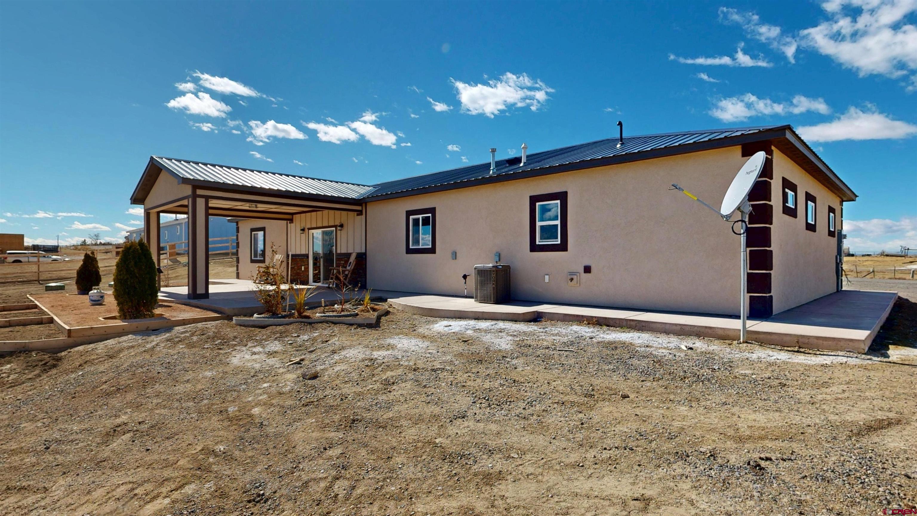 3728 Ruth Lane Delta, CO 81416 - Photo 28 of 34 a view of the house with backyard and sitting area