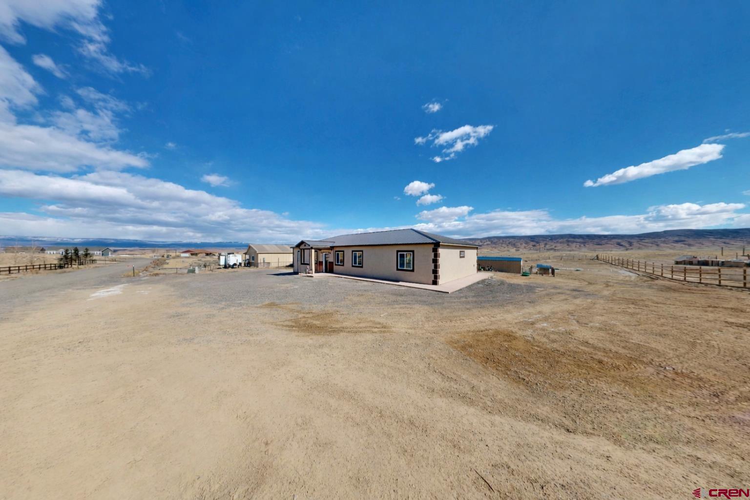 3728 Ruth Lane Delta, CO 81416 - Photo 30 of 34 a view of a building with a big yard