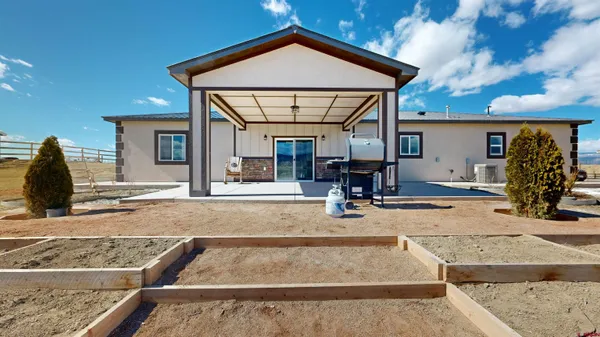 a view of a house with entrance gate