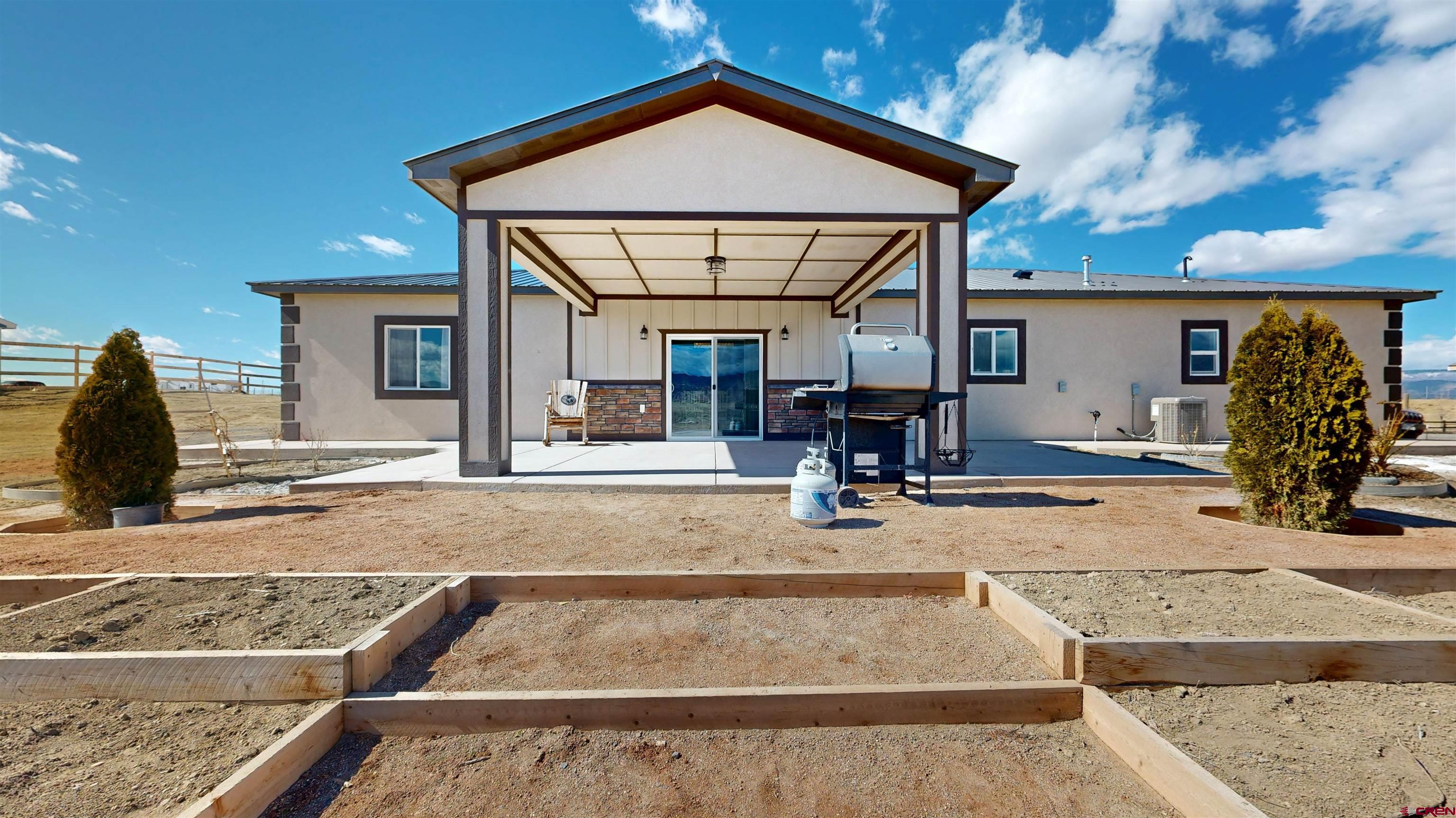 3728 Ruth Lane Delta, CO 81416 - Photo 3 of 34 a view of a house with entrance gate