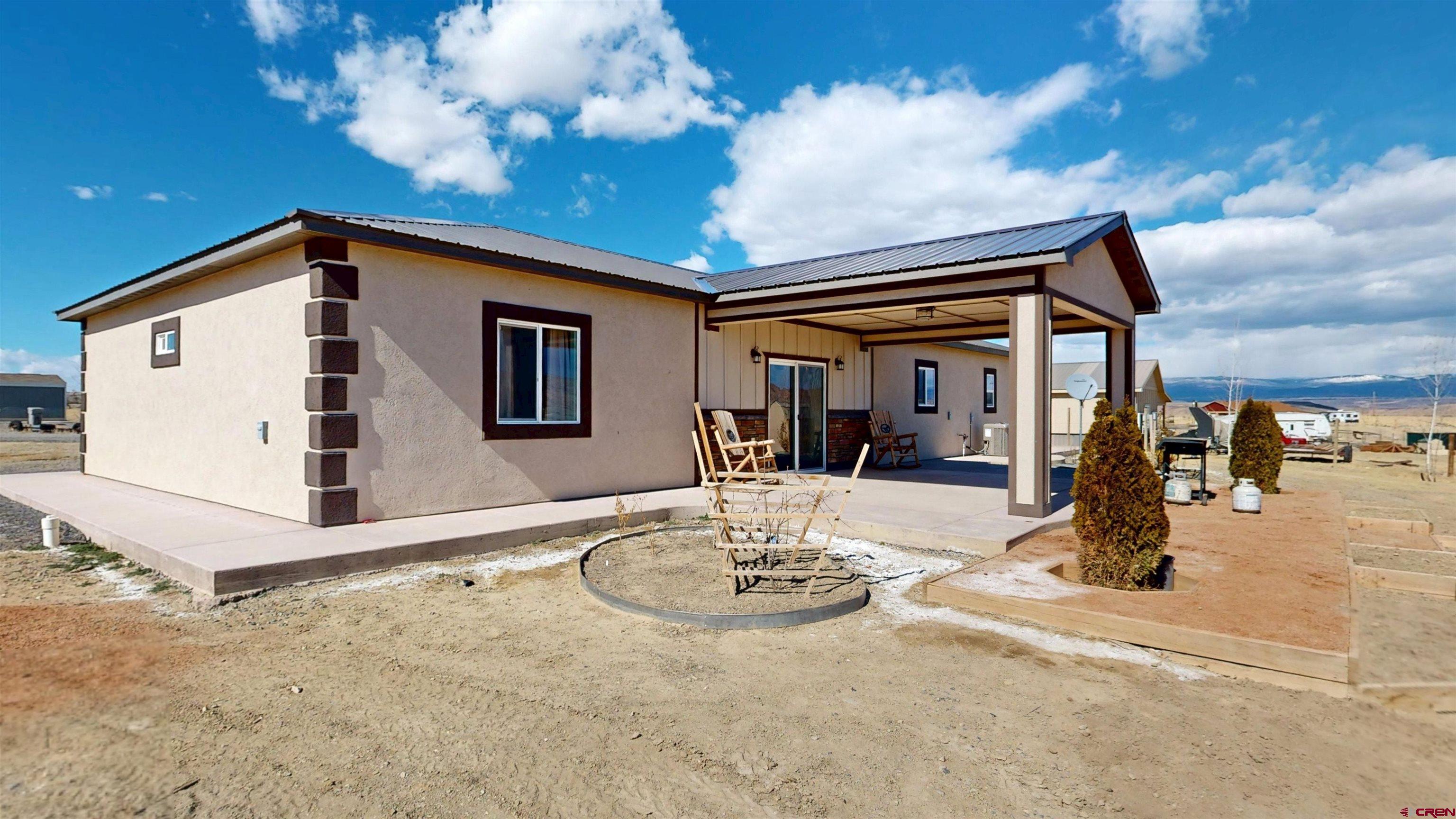 3728 Ruth Lane Delta, CO 81416 - Photo 33 of 34 a view of a livingroom with furniture and mirror
