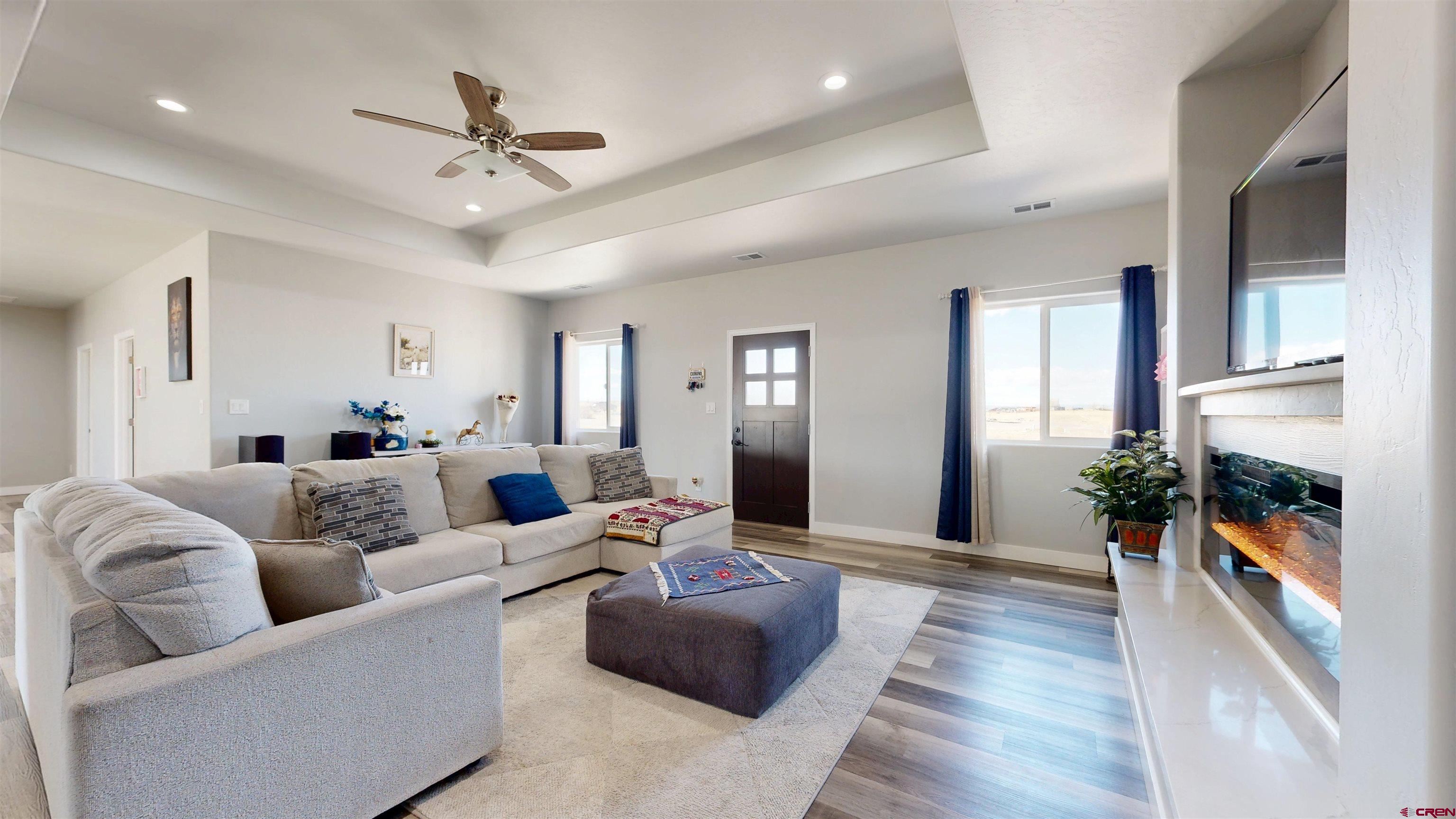 3728 Ruth Lane Delta, CO 81416 - Photo 6 of 34 a living room with furniture and a chandelier