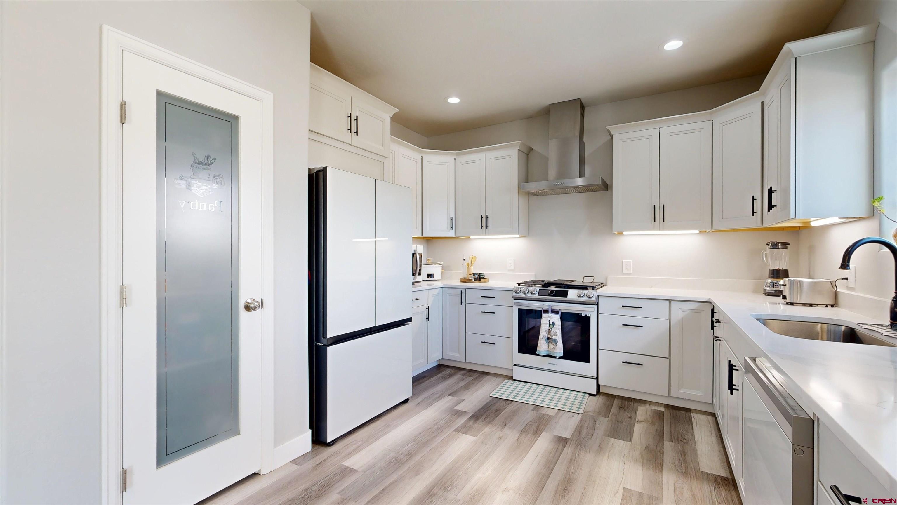 3728 Ruth Lane Delta, CO 81416 - Photo 9 of 34 a kitchen with stainless steel appliances granite countertop a refrigerator and a stove top oven