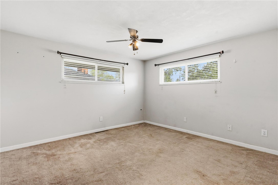 3890 Endover Road Dayton, OH 45439 - Photo 24 of 26 This spacious room features ample natural light and a practical ceiling fan for year-round comfort.