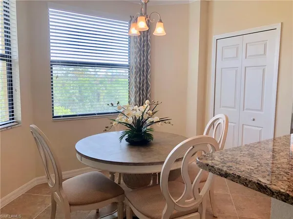 a dining room with furniture and window