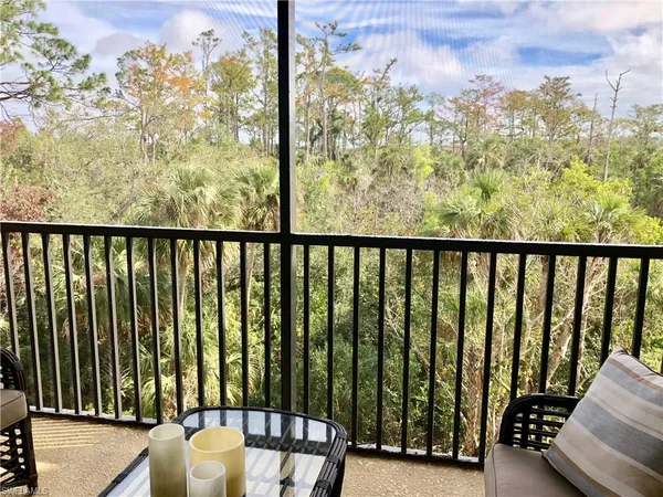 a view of balcony with furniture