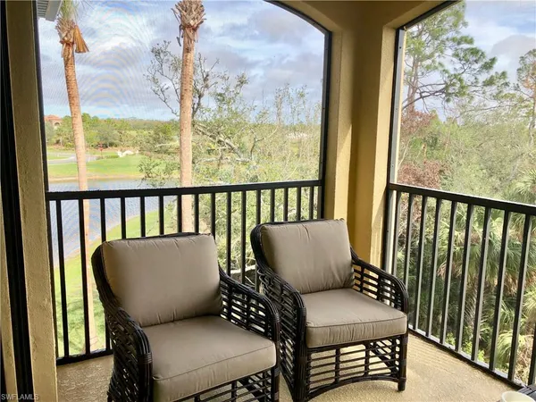 a view of chair in balcony with furniture