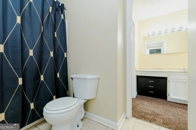 a bathroom with a toilet and a sink