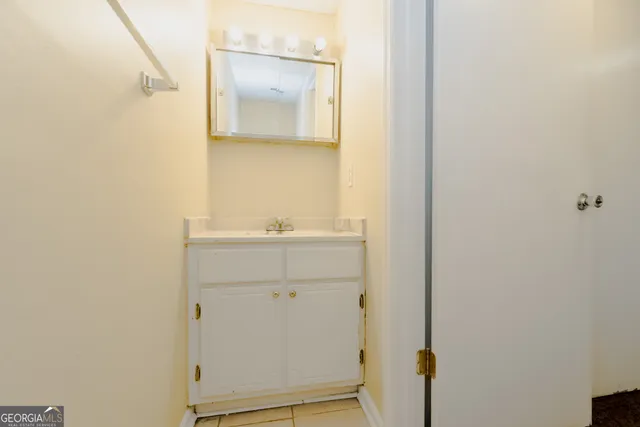 a bathroom with a sink and mirror
