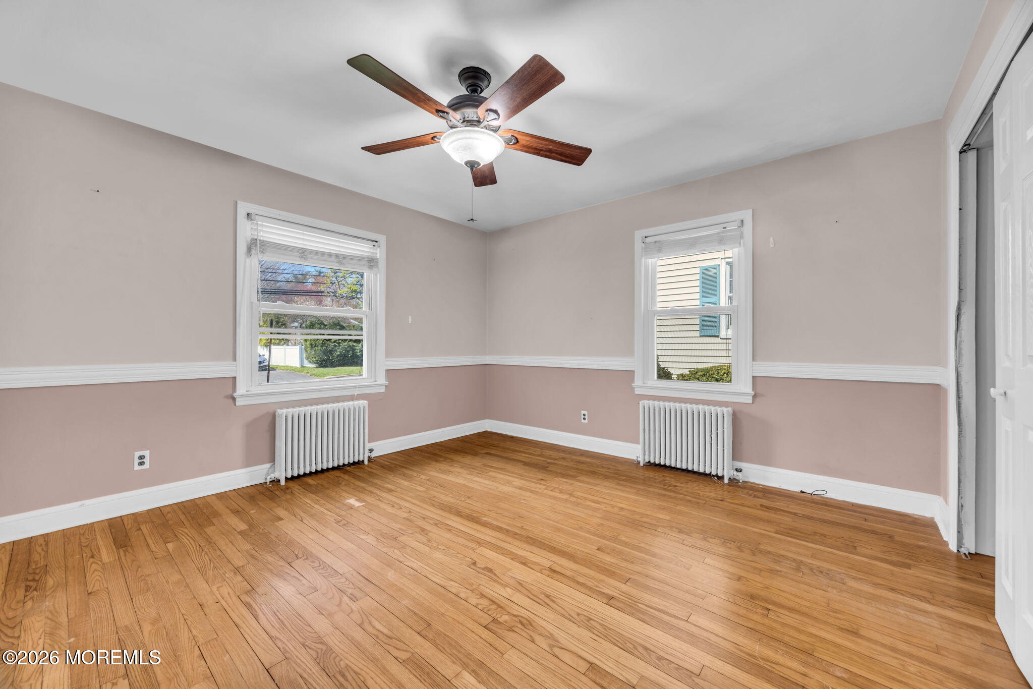 23 Spring Street Freehold, NJ 07728 - Photo 11 of 31 wooden floor in an empty room with a window