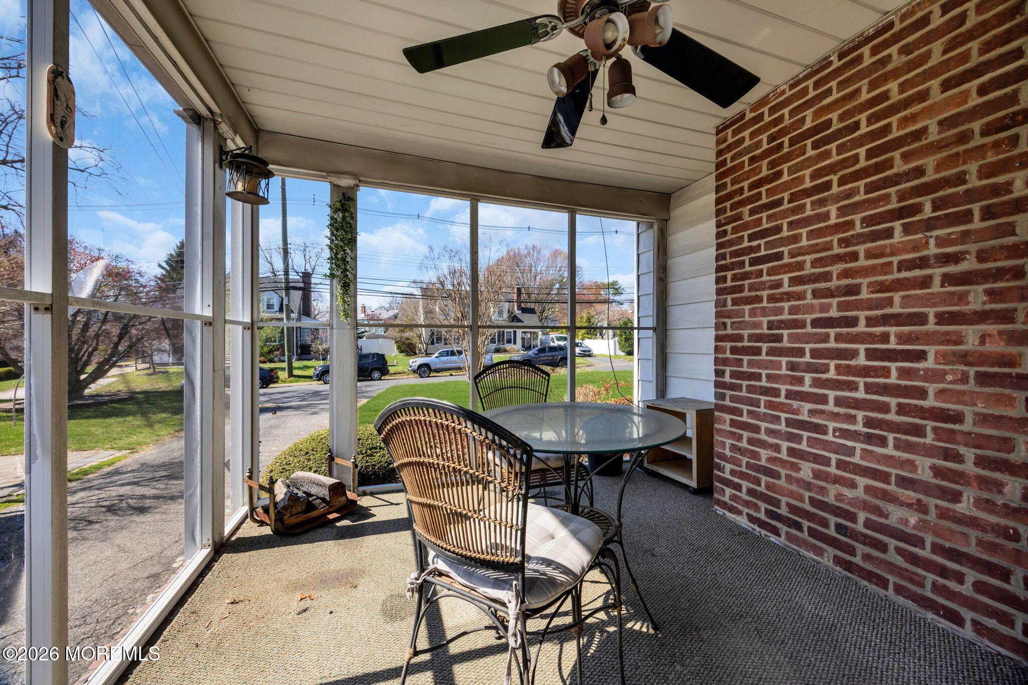 23 Spring Street Freehold, NJ 07728 - Photo 14 of 31 a view of a patio with table and chairs and couches with wooden floor
