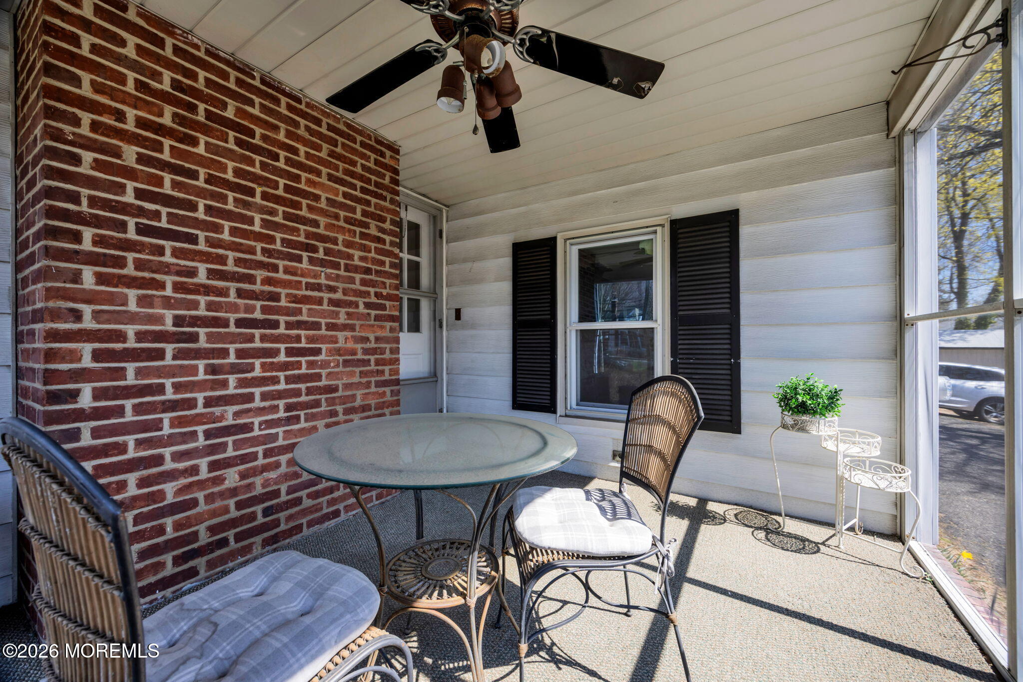 23 Spring Street Freehold, NJ 07728 - Photo 15 of 31 a backyard of a house with table and chairs