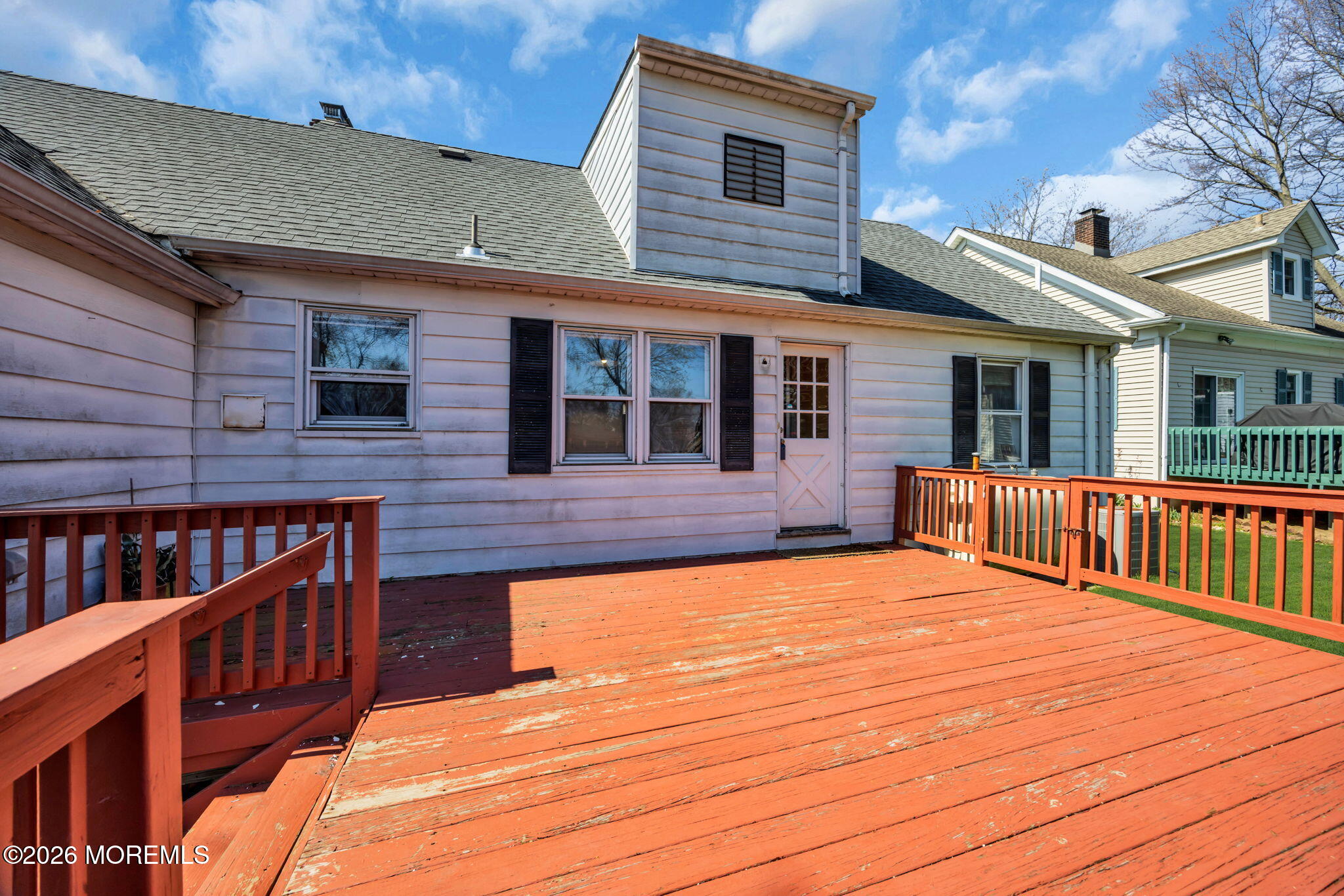 23 Spring Street Freehold, NJ 07728 - Photo 22 of 31 a backyard of a house with deck and furniture