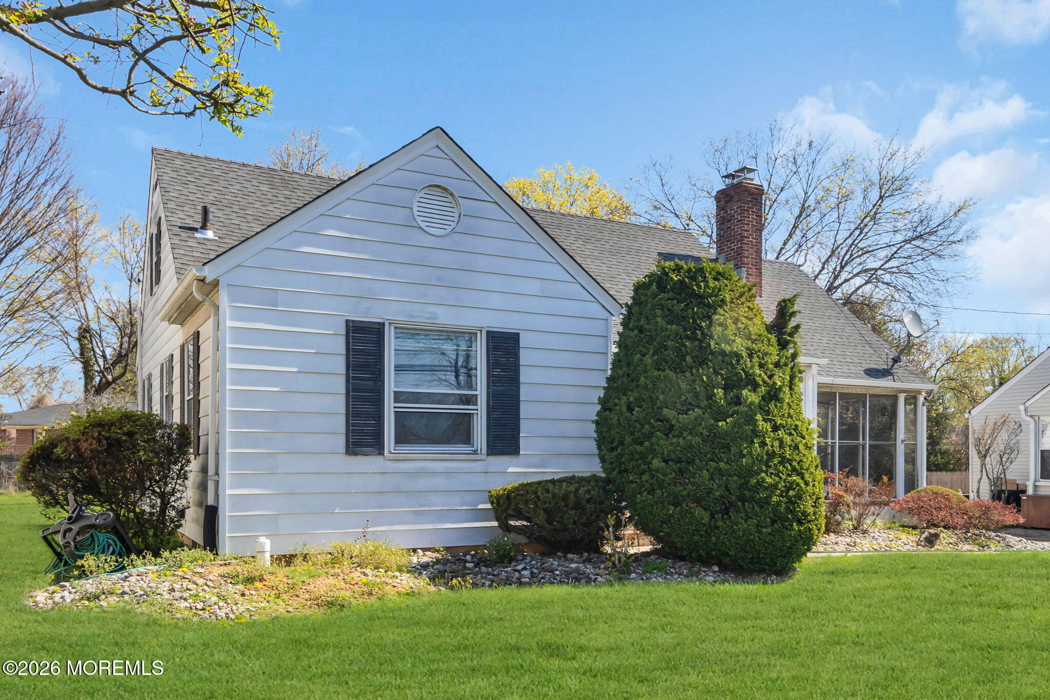 23 Spring Street Freehold, NJ 07728 - Photo 27 of 31 a front view of a house with a garden and plants