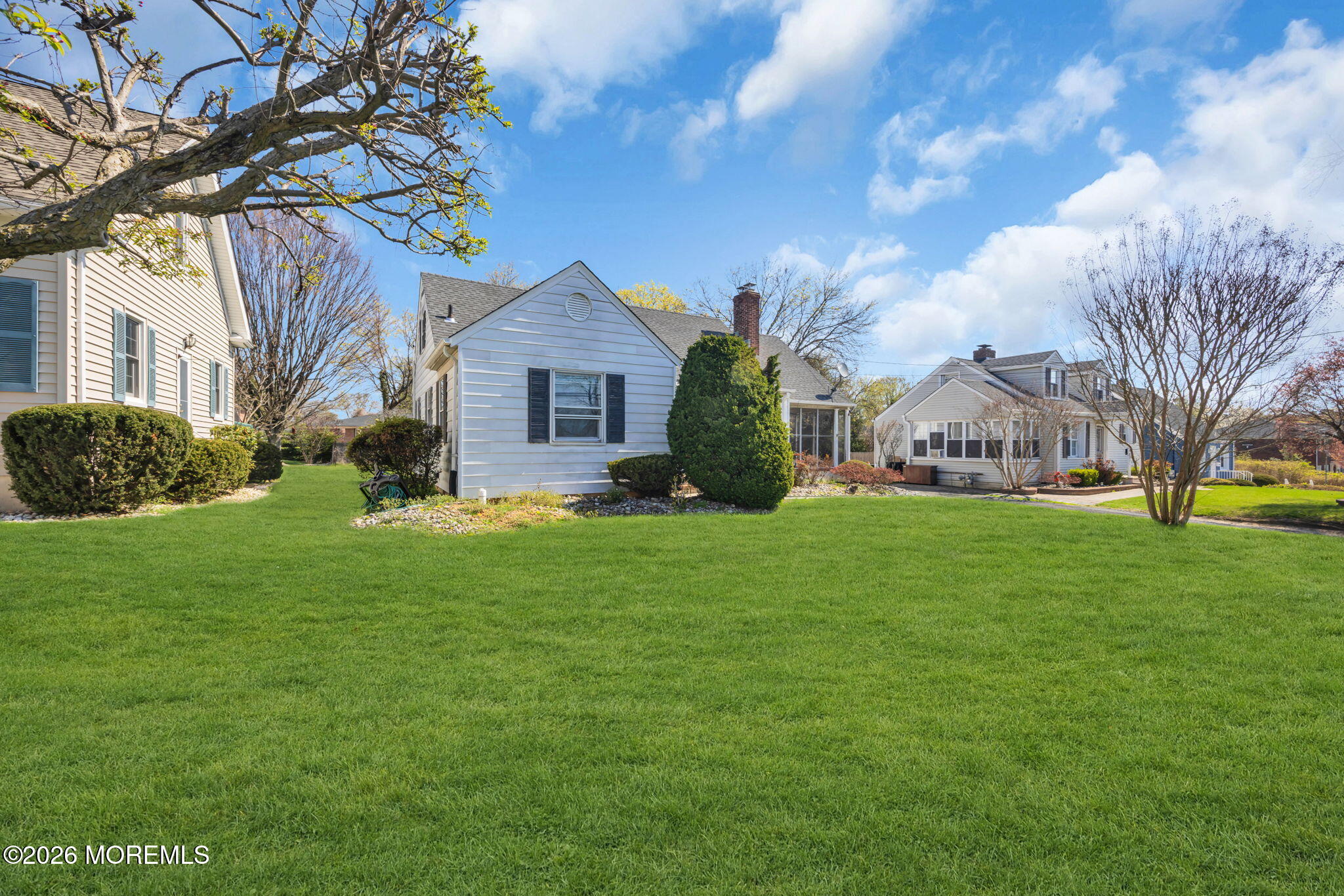 23 Spring Street Freehold, NJ 07728 - Photo 28 of 31 a view of a house with a big yard plants and large trees