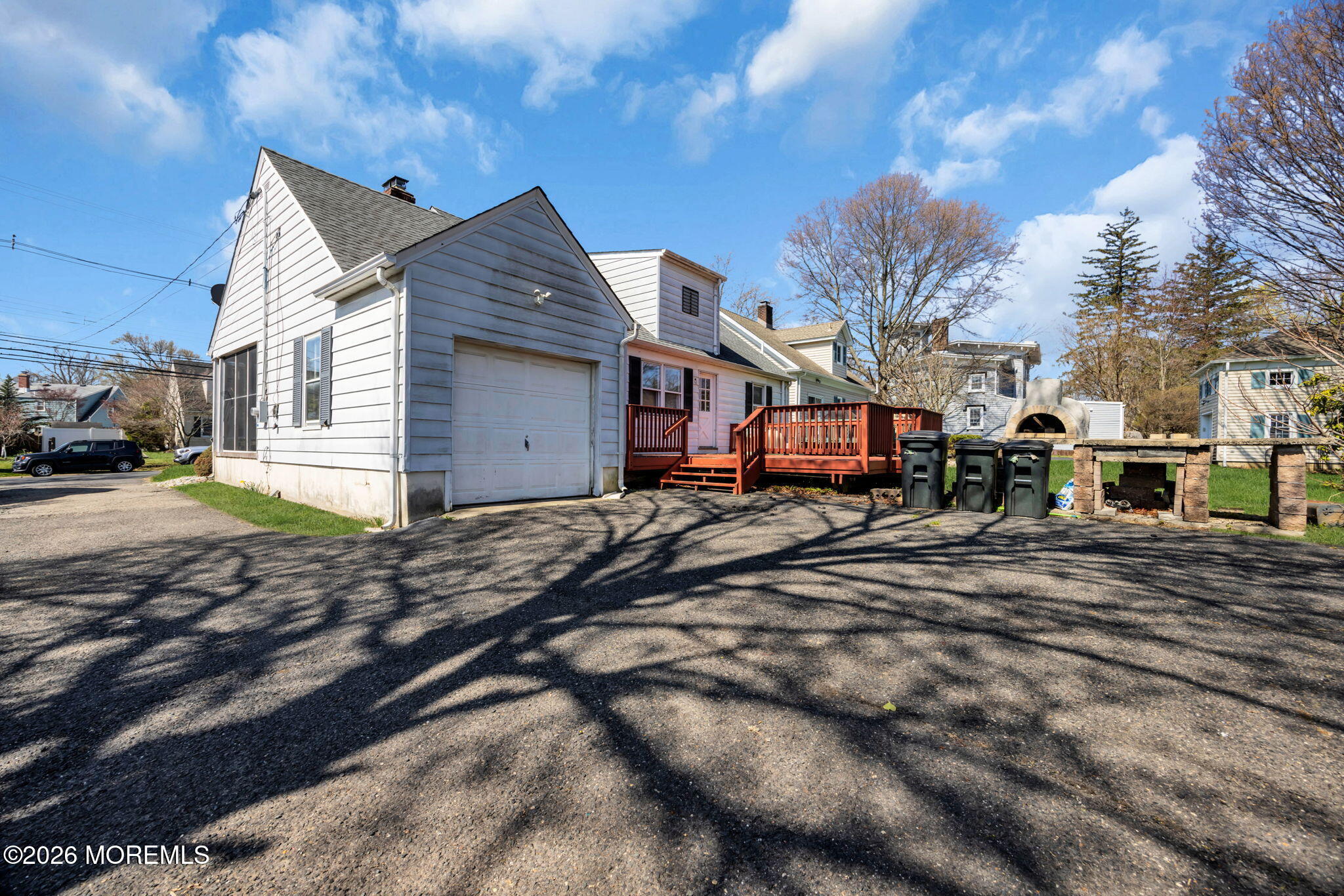 23 Spring Street Freehold, NJ 07728 - Photo 29 of 31 a view of a house with a yard covered in snow