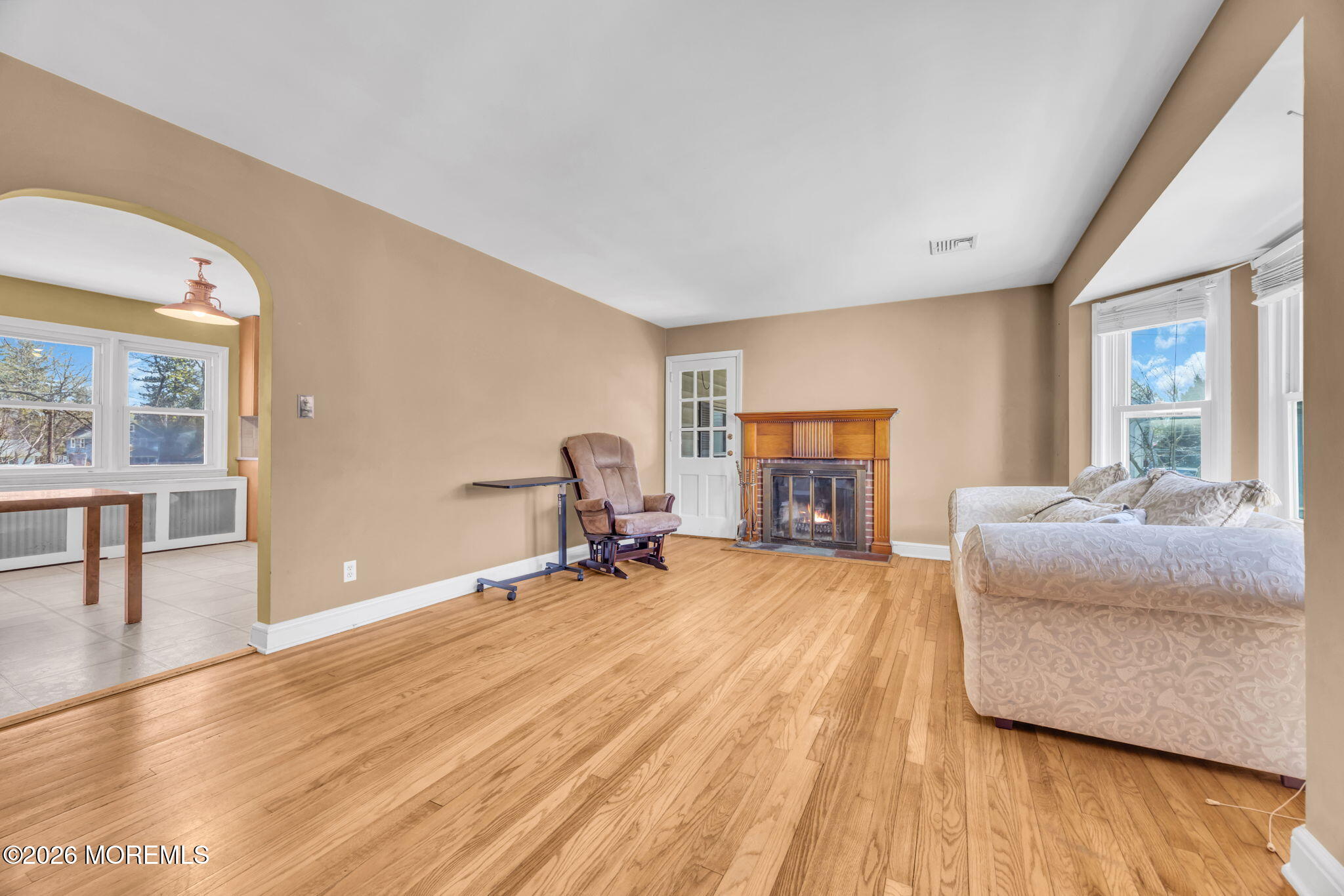 23 Spring Street Freehold, NJ 07728 - Photo 4 of 31 a living room with furniture and a fireplace