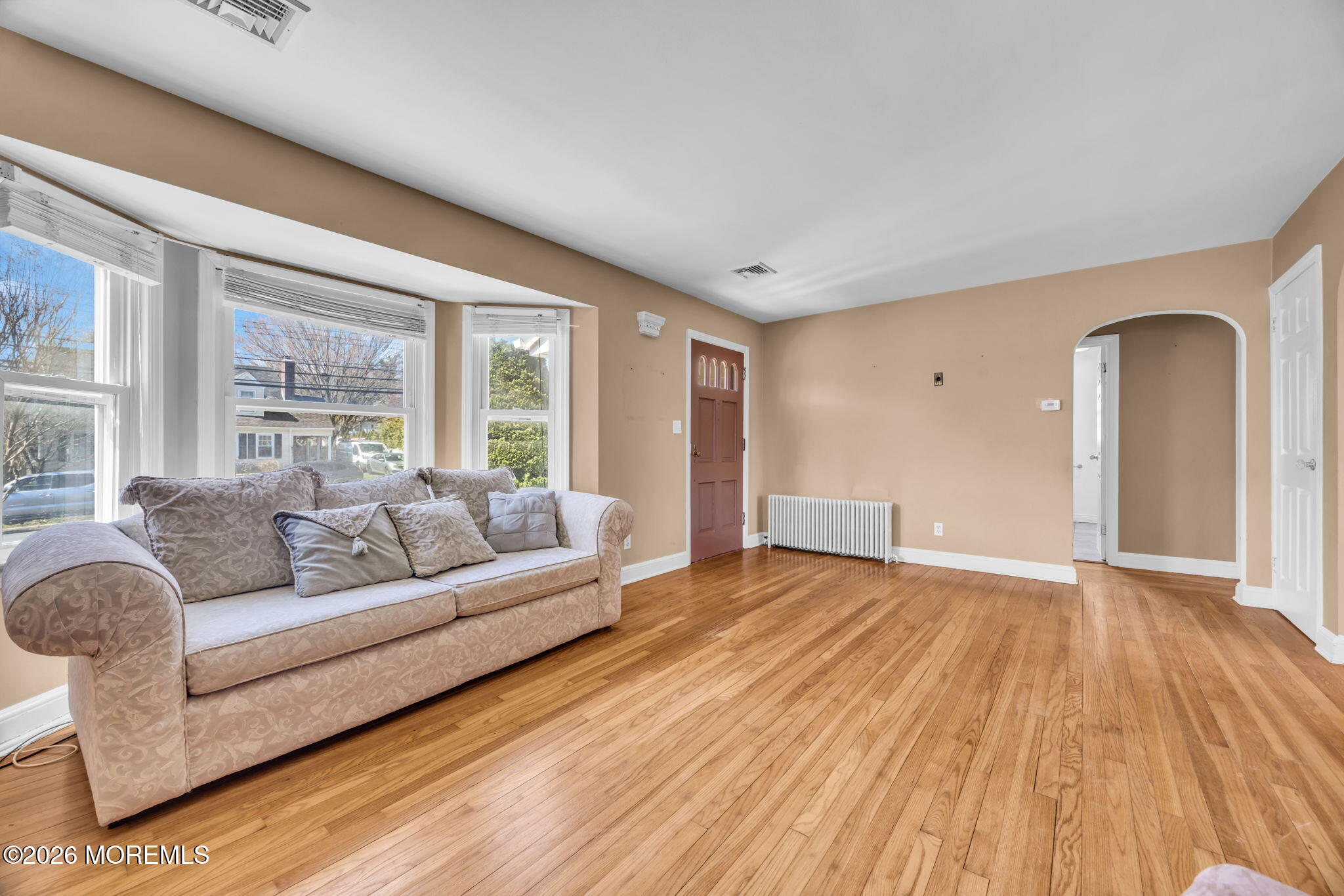 23 Spring Street Freehold, NJ 07728 - Photo 5 of 31 a living room with furniture and a large window