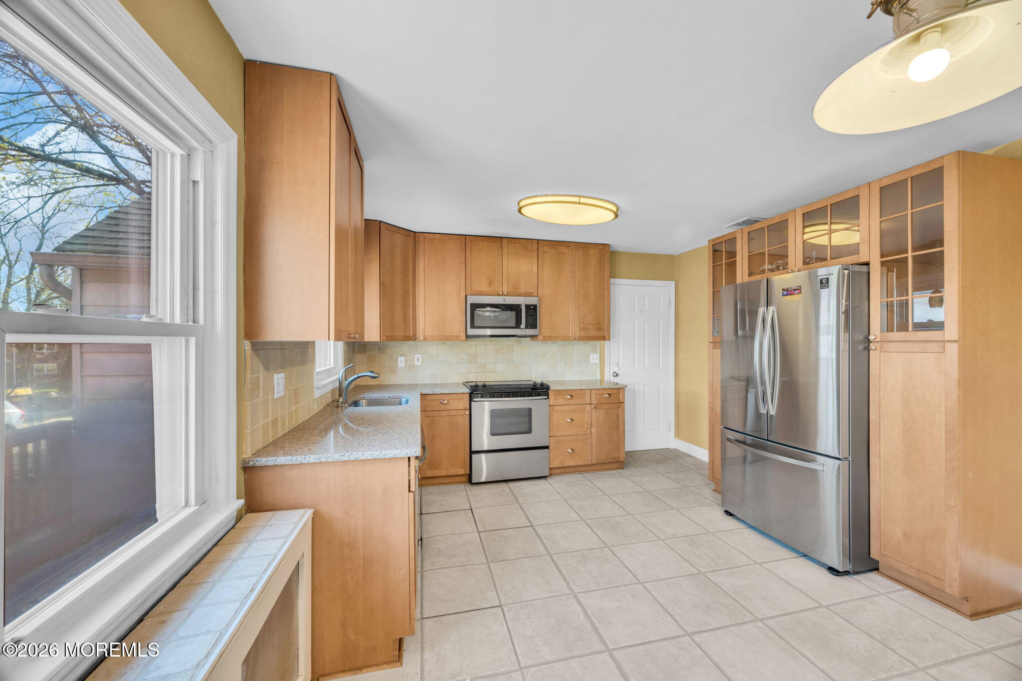 23 Spring Street Freehold, NJ 07728 - Photo 9 of 31 a kitchen with stainless steel appliances granite countertop a refrigerator and a stove