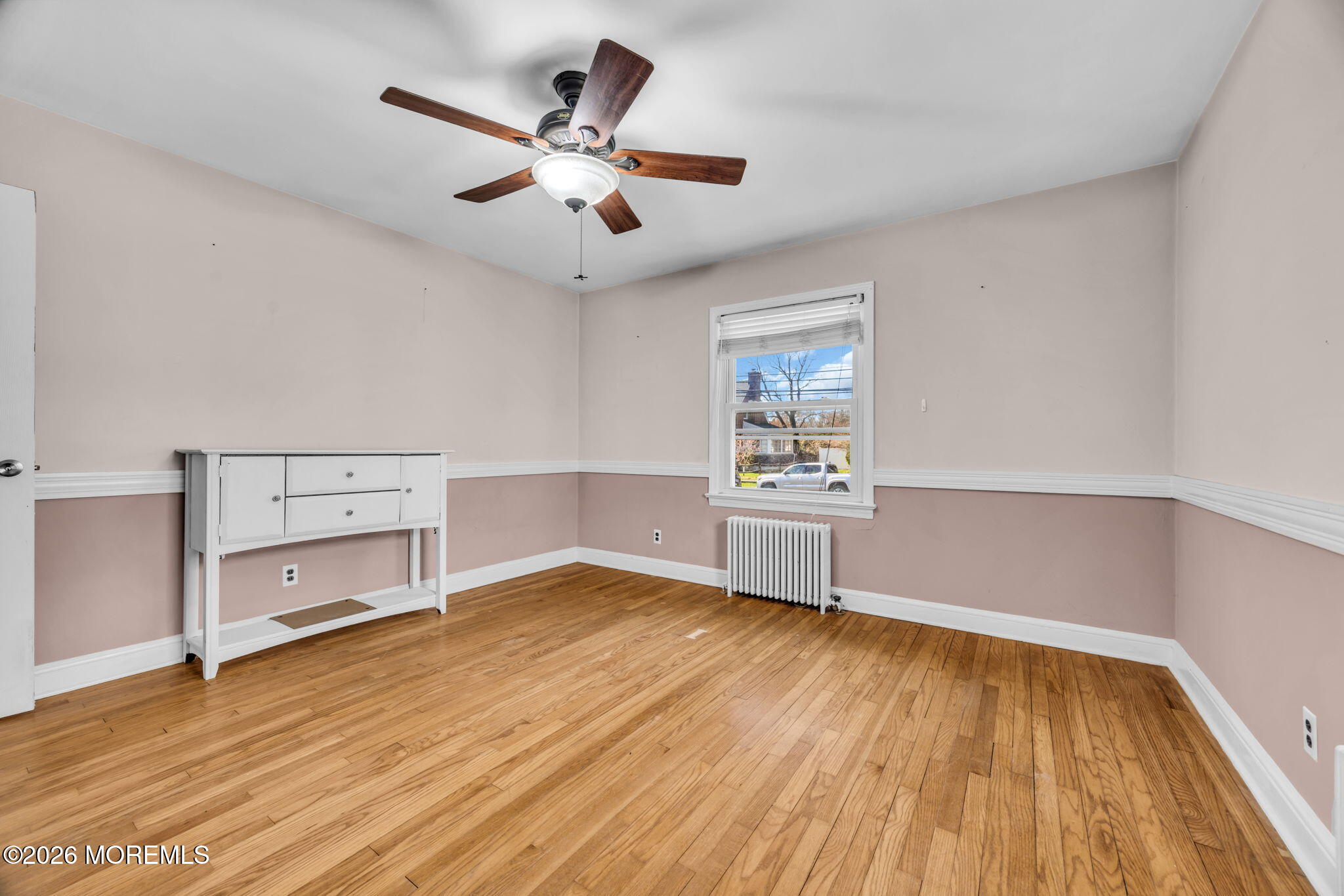23 Spring Street Freehold, NJ 07728 - Photo 10 of 31 wooden floor in an empty room with a window