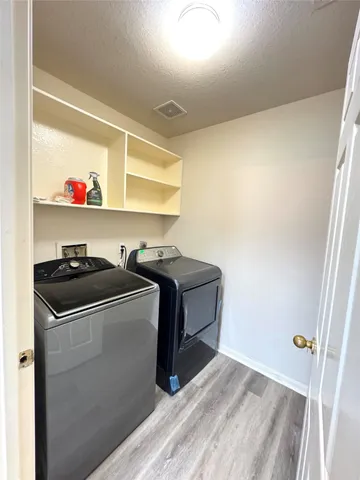a utility room with washer and dryer