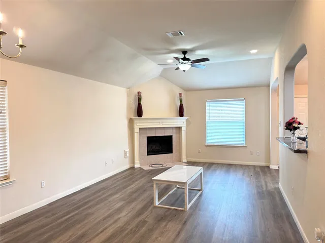 a living room with furniture and a fireplace