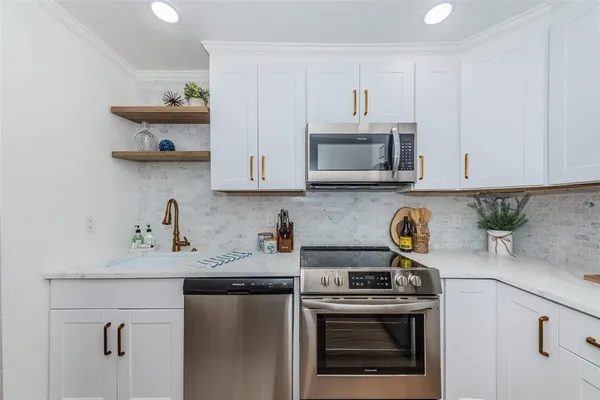 a kitchen with a stove and a microwave