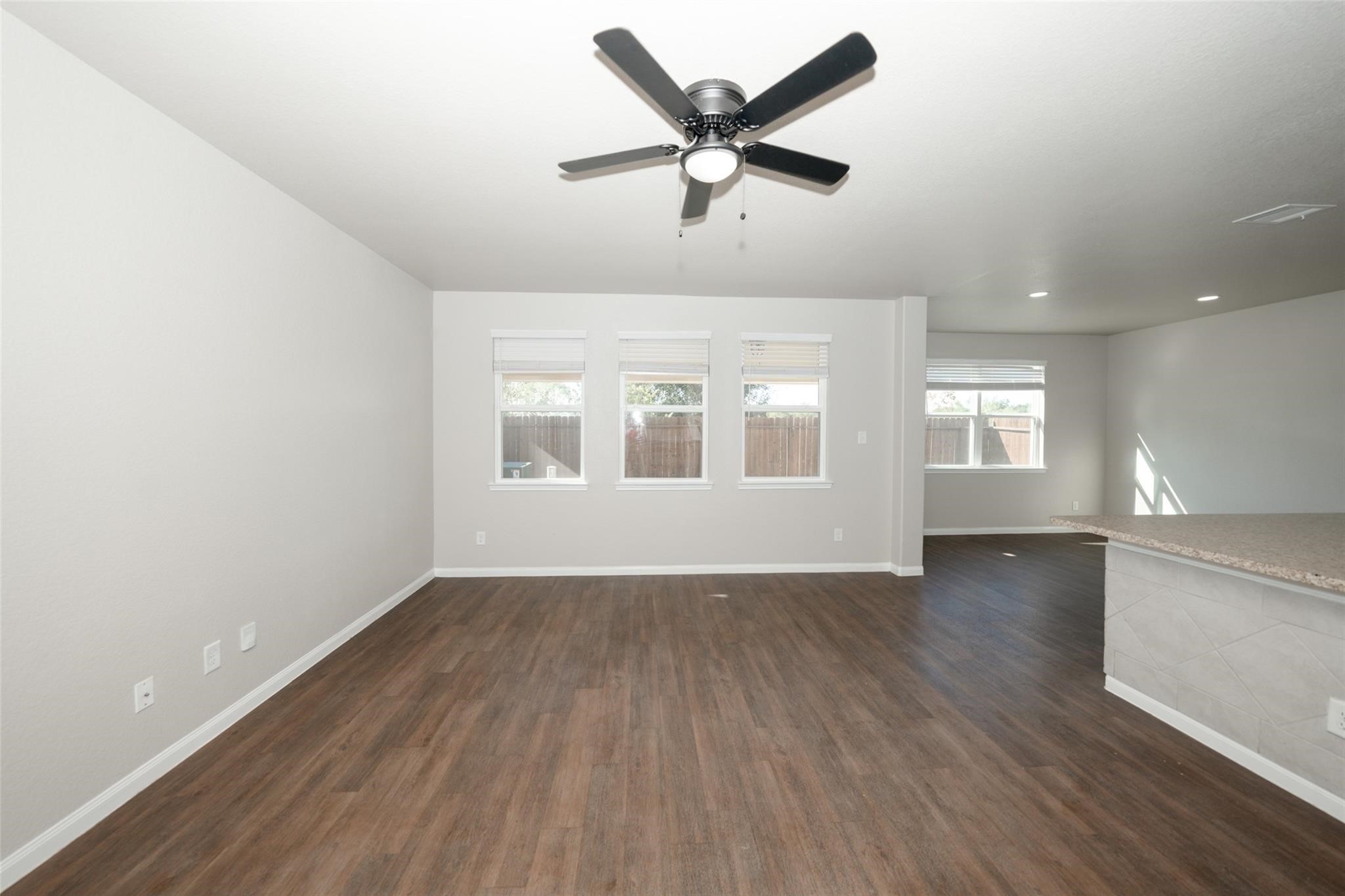 18834 Lansdowne Stream Path Katy, TX 77449 - Photo 11 of 21 wooden floor in an empty room with a window