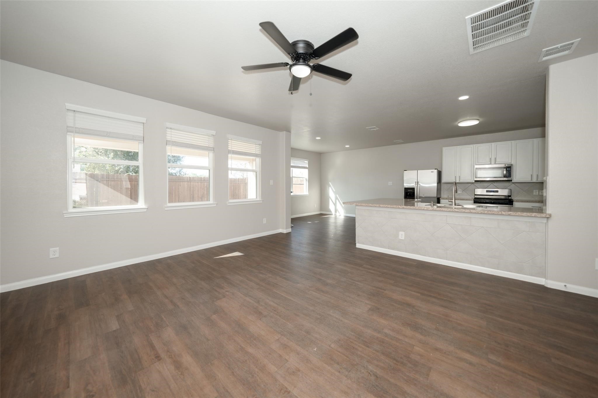 18834 Lansdowne Stream Path Katy, TX 77449 - Photo 2 of 21 a view of a kitchen with an empty space and a window