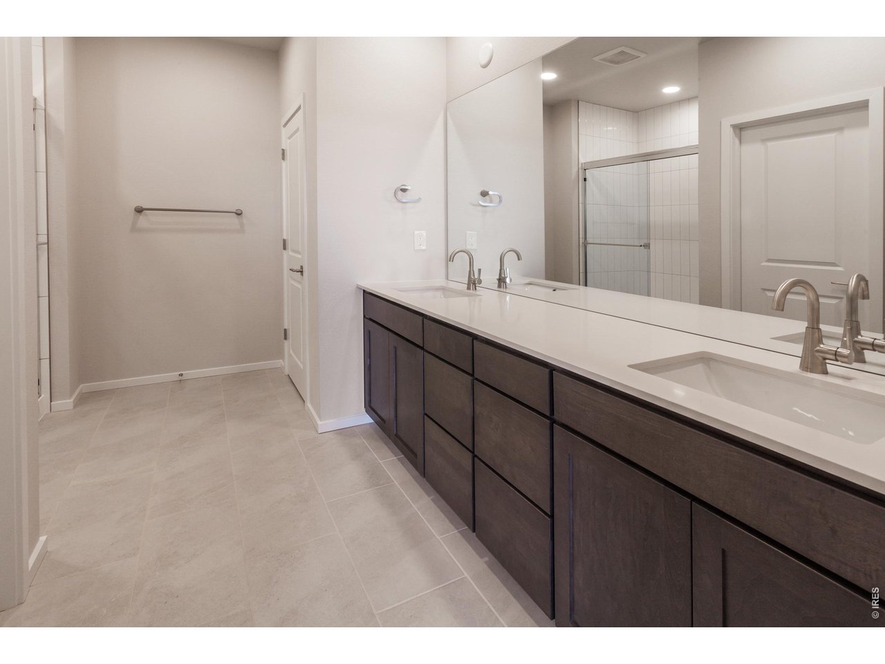 792 Chatter Road Windsor, CO 80550 - Photo 29 of 49 a bathroom with a sink and a mirror