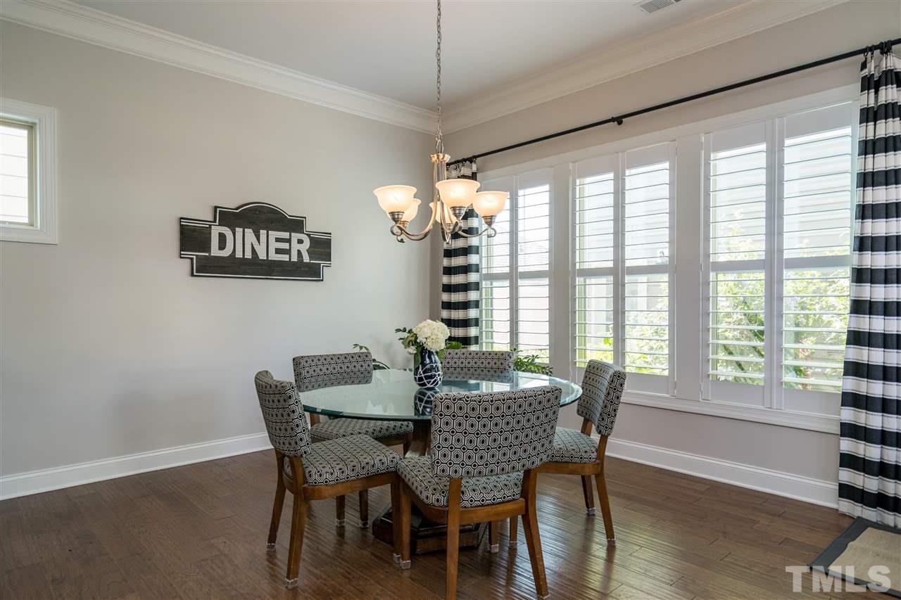 1400 Van Page Boulevard Raleigh, NC 27607 - Photo 14 of 30 Enjoy eating in this cozy, light drenched eating nook overlooking the back garden and open to the living space and kitchen.