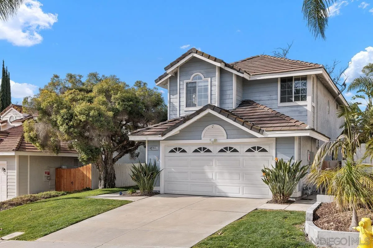 14680 Carmel Ridge Road San Diego, CA 92128 - Photo 3 of 33 a front view of a house with a yard