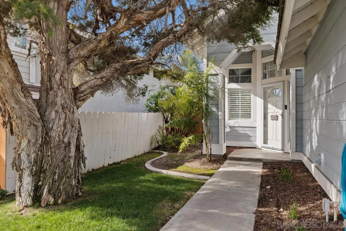 14680 Carmel Ridge Road San Diego, CA 92128 - Photo 4 of 33 a front view of a house with a yard