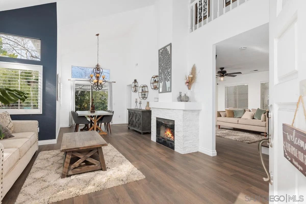 14680 Carmel Ridge Road San Diego, CA 92128 - Photo 6 of 33 a living room with furniture and a fireplace