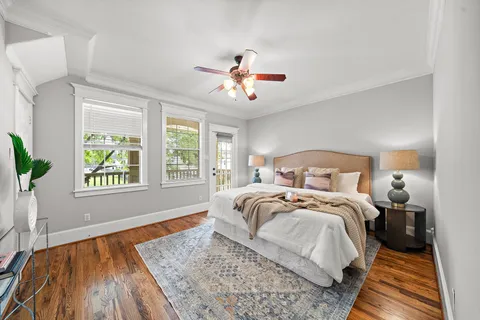 a bedroom with bed and a window