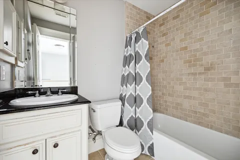 a bathroom with a sink a toilet and a bathtub